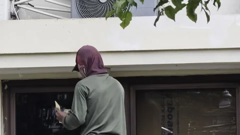 Construction worker sanding a concrete in Surakarta, Indonesia - August 05, 2026 Stock-Footage 341504738