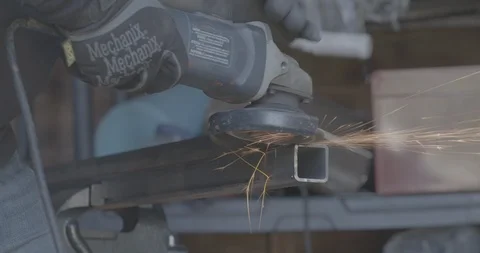 Construction Worker Sanding Steel Pole Stock Footage 101400153