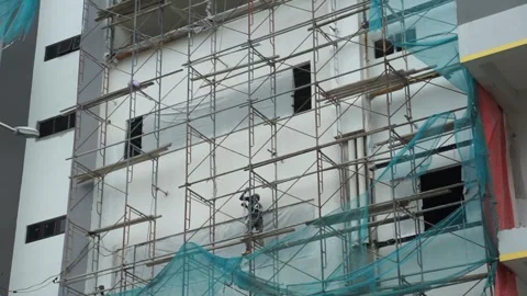 Construction worker on scaffolding Stock-Footage 296359414