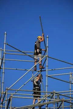 Construction worker on scaffolding Stock Photos