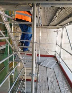 Construction Worker on Scaffolding Staircase at 150 Meters Height Stock Photos