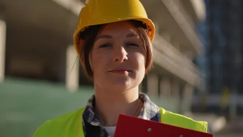 Construction worker is seen on site wearing essential safety gear for protection Stock Footage 311863428