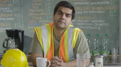 Construction worker with serious expression looking at camera Stock Footage 62254795