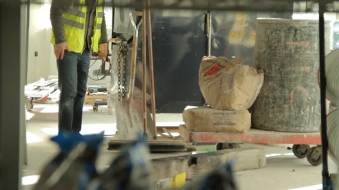 Construction Worker sets down a Shovel. Stock Footage 88607544