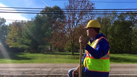 Construction Worker With Shovel On The Side of The road Video stock 81410224