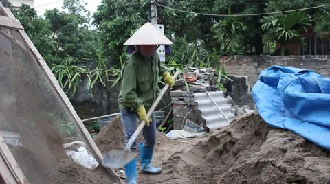 Construction worker shoveling sand. Stock Footage 46458591