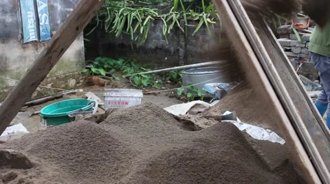 Construction worker shoveling sand. Stock Footage 46459690