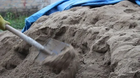 Construction worker shoveling sand. Stock Footage 46459733