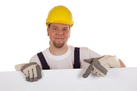 Construction worker showing on a blank sign Stock Photos