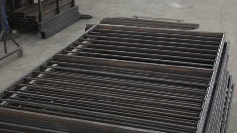 Construction worker at the site welding metal pipes with special blue helmet Vídeo Stock 142876950