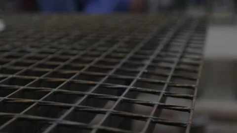 Construction worker at the site welding metal pipes with special blue helmet Vídeos de archivo 142876988