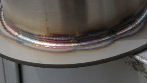 Construction worker at the site welding metal pipes with special blue helmet Stock-Footage 142881239