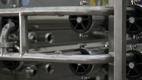 Construction worker at the site welding metal pipes with special blue helmet Stock Footage 142887142