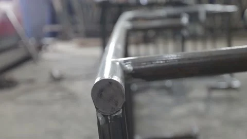 Construction worker at the site welding metal pipes with special blue helmet Stock Footage 142889938