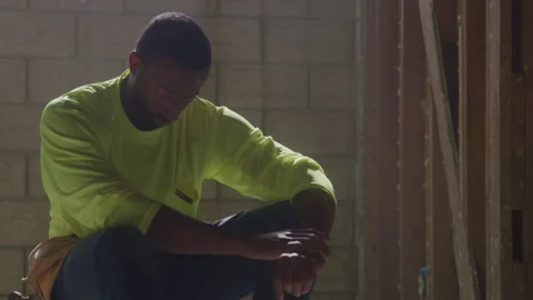 Construction Worker Sits With Head Down Stock Footage 270391176