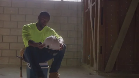 Construction Worker Sits Holding Hard Hat Stock Footage 270391229