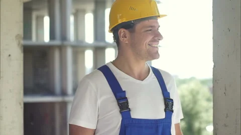 Construction worker on a sky background Stock Footage 114584112
