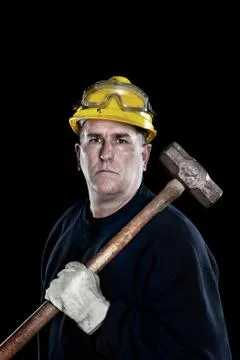 Construction worker with sledgehammer Stock Photos
