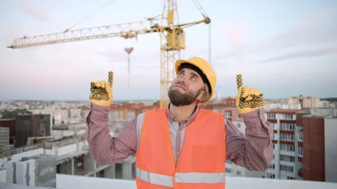 Construction worker in slow motion showing thumb up on Stock Footage 295960840