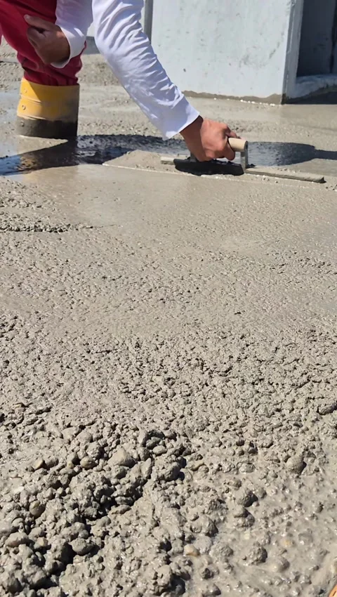 Construction worker smoothing fresh concrete vertical video 動画素材 340157312
