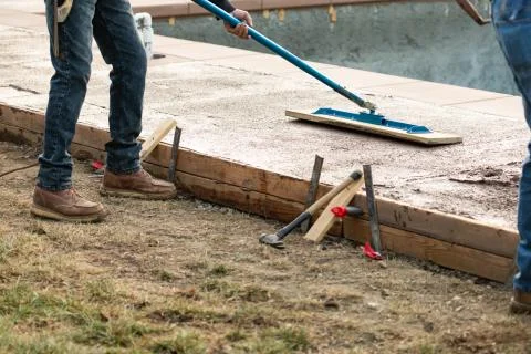 Construction Worker Smoothing Wet Cement With Trowel Tool Stock Photos
