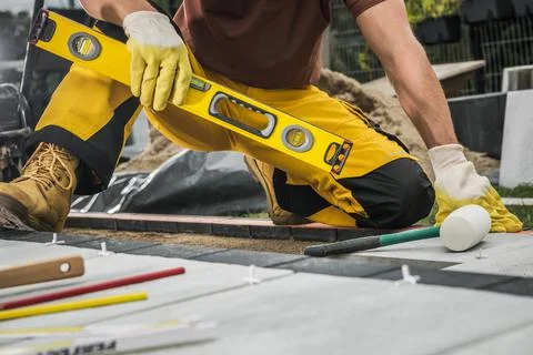Construction Worker with Spirit Level Tool in His Hand 写真素材