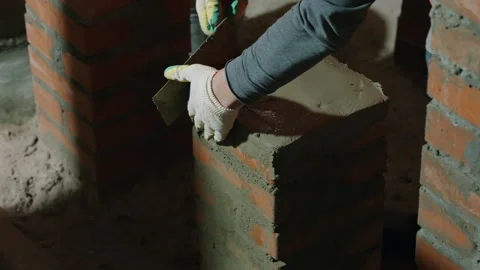 Construction Worker Spreading Fresh Mortar Across Brick Masonry Stock Footage 343354664