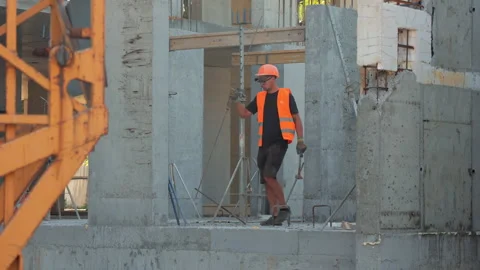 Construction Worker Standing Among Concrete Columns, Man In Safety Vest And Stock Footage 317195114