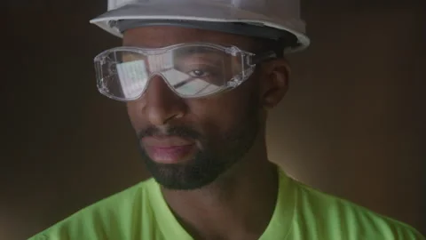 Construction Worker Standing Wearing Protective Goggles &amp; Hard Hat Looks Stock-Footage 270388576