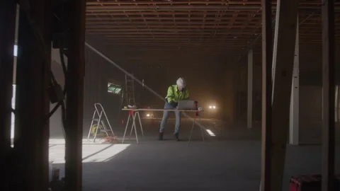 Construction Worker Stands At Desk On Job Site Видео 270388593