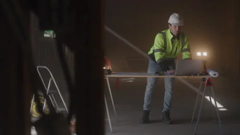 Construction Worker Stands At Desk Working Stock Footage 270388625