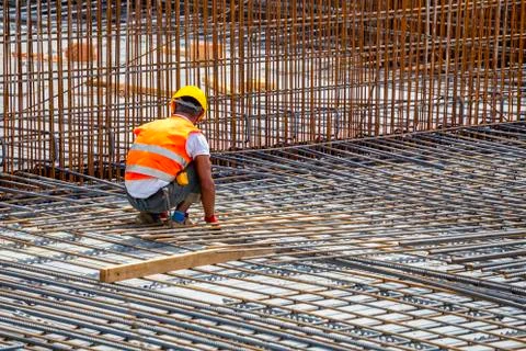 Construction worker surrounded by rebar Stock Photos