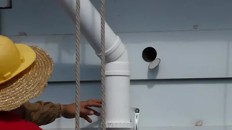 The construction worker is suspended on the wall Video stock 66938755