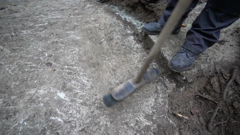 Construction worker sweeping and cleaning concrete foundation Stock Footage 158974022