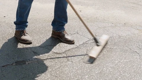 Construction Worker Sweeping Away Concrete Dust Stock Footage 85637751