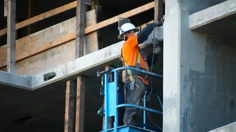Construction worker takes measurement and polishes the wall at development site Stock Footage 34133881