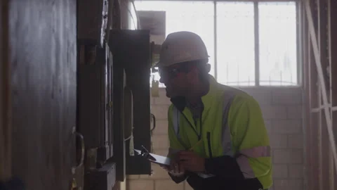 Construction Worker Takes Notes By Electrical Box Stock Footage 270390302