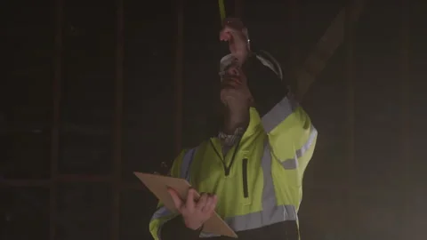 Construction Worker Taking Notes Wearing A Headlamp On Hard Hat Stock Footage 270391047