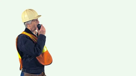 Construction worker talking on his radio white background Stock Footage 88221494