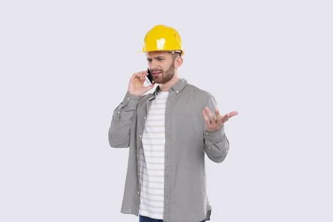Construction Worker Talking on Phone Angry Standing Isolated. Commecial Stock Photos