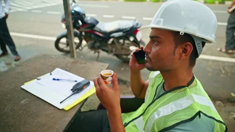 Construction worker talking on phone during break time Stock Footage 297601017