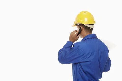 Construction worker talking on the phone Stock Photos