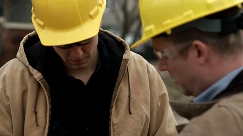 Construction worker talking to supervisor 4k Stock Footage 88961076