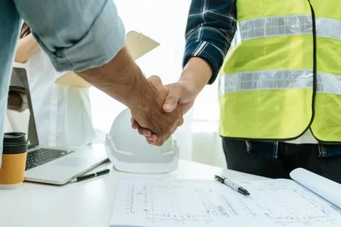 Construction worker team contractor handshake after business meeting Stock Photos