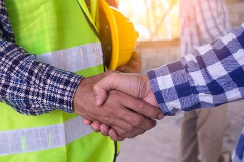Construction worker team hands shaking greeting start up plan new project con Foto stock