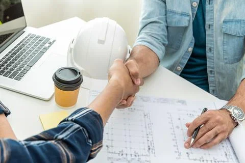 Construction worker team hands shaking after business meeting start up projec Stock Photos
