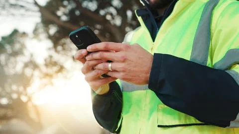 Construction worker, texting and hands with phone, outdoor or communication.. Stock Photos