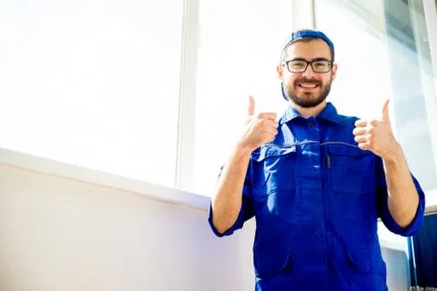 Construction worker thumbs up Stock Photos