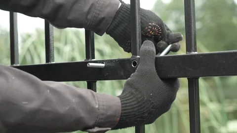 Construction worker tightens a Bolt with a metal Wrench Video stock 261500525