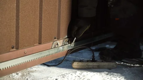 Construction worker tightens a Bolt with a metal Wrench Stock Footage 263801806